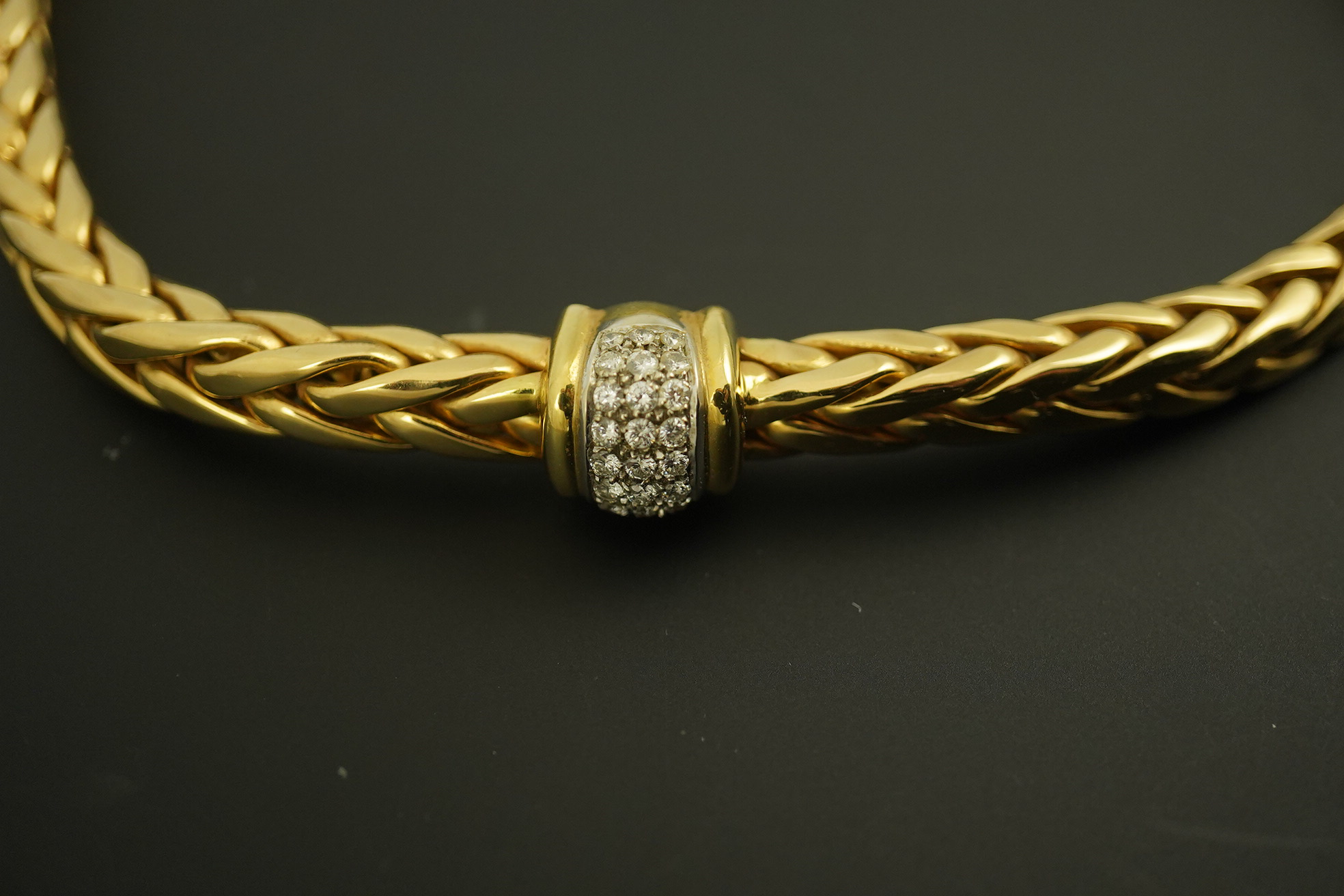 A modern Mappin & Webb 18ct gold interwoven link necklace, with two pave set diamond bands